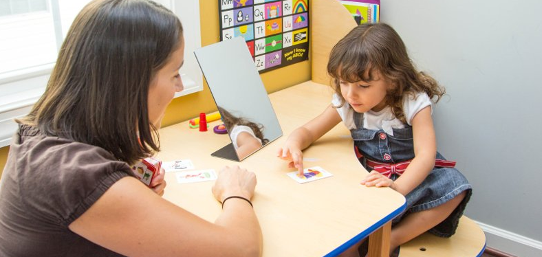 Small girl with teacher